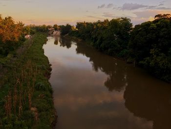 Scenic view of landscape against sky at sunset