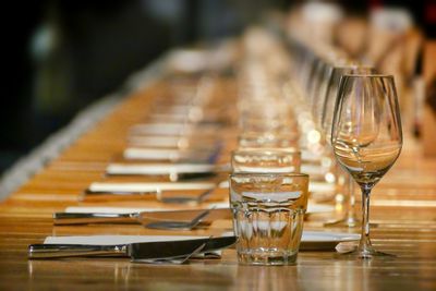 Close-up of wine glasses on table