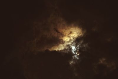 Low angle view of moon in sky at night