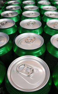 Full frame shot of green cans