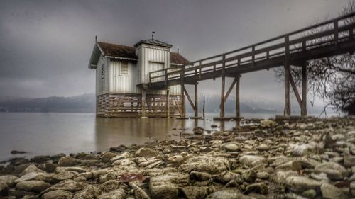 Built structure on beach against sky