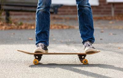 Low section of man skateboarding on skateboard