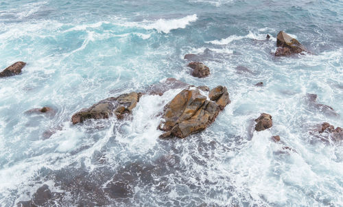 High angle view of rocks on beach