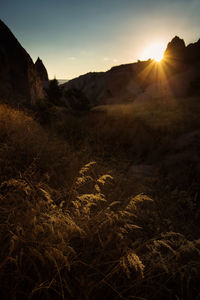 Scenic view of mountains against sky during sunset