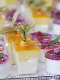 Close-up of fruit desserts served on table
