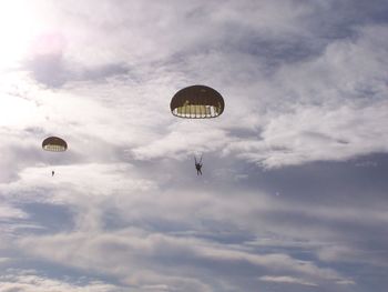 Low angle view of hot air balloons flying in sky