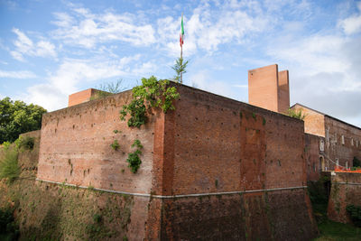 Low angle view of old building against sky