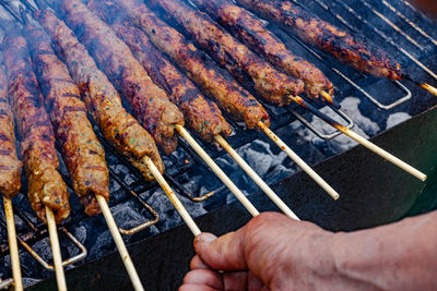 Close-up of meat shish kebab on a barbecue
