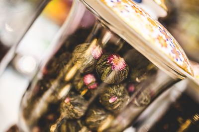 High angle view of candies in jar on table