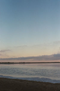 Scenic view of sea against sky at dusk