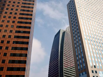 Low angle view of skyscrapers against sky