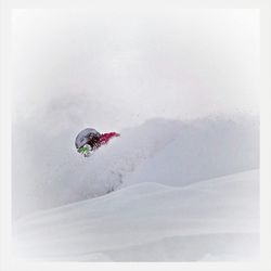 Low angle view of person snowboarding