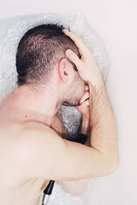 Close-up of shirtless man