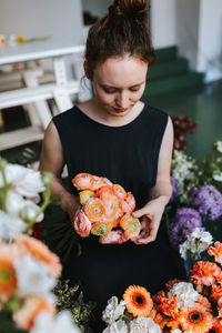Close-up of woman holding flower bouquet