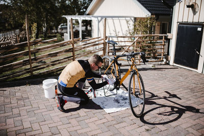 Man repairing bicycle