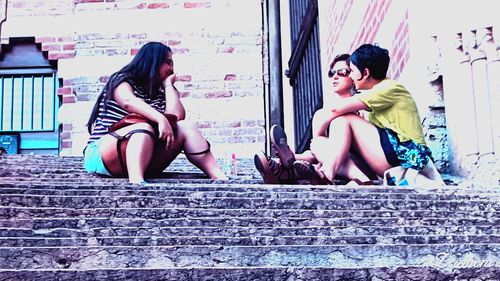 Young woman sitting outdoors