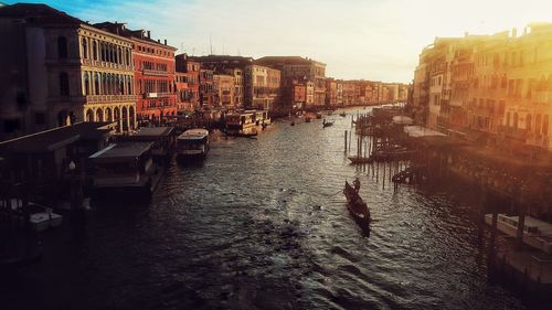 High angle view of canal amidst buildings in city