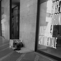 Garbage on street against building