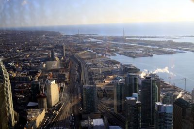 High angle view of buildings in city against sky