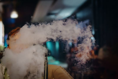 Close-up of smoke emitting from camera