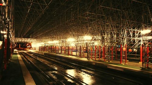 Train at railroad station at night