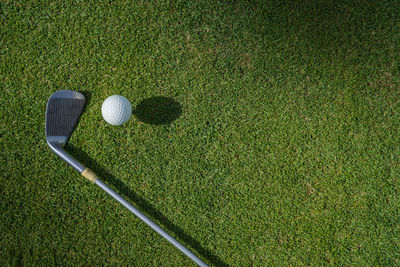 High angle view of golf ball on field