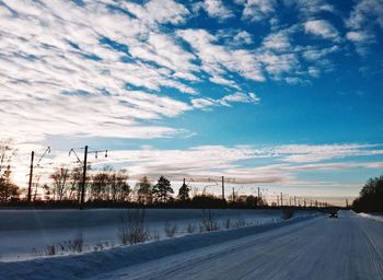 Snow covered landscape against sky