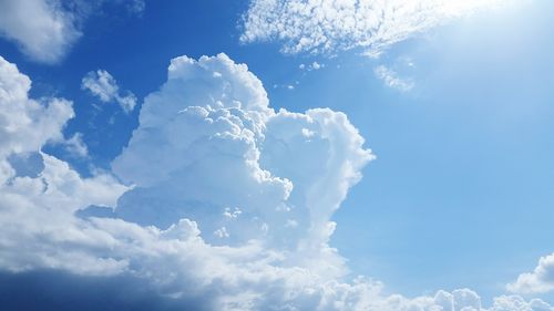 Low angle view of cloudscape against blue sky