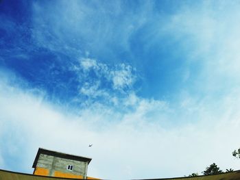 High section of built structure against blue sky