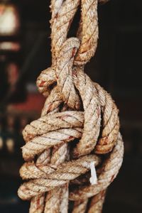 Close-up of rope tied up on metal