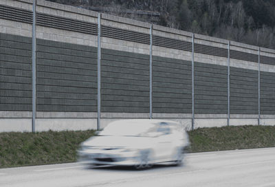 Blurred motion of car on road