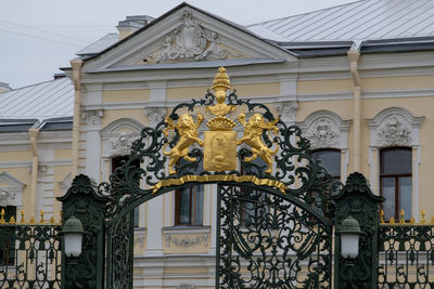 Low angle view of statue against building