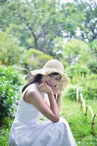 Portrait of woman sitting in park