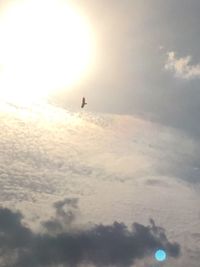 Silhouette person against sky during sunset