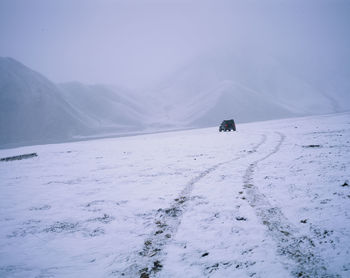 Scenic view of snow covered mountain against sky
