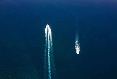 High angle view of boat sailing in sea