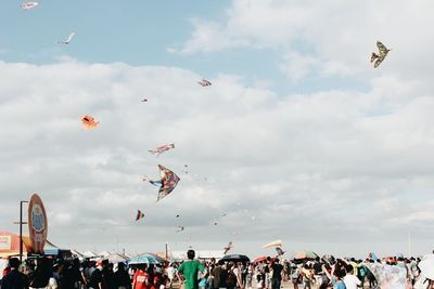 Low angle view of birds flying in sky