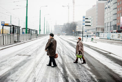 People walking on road in city