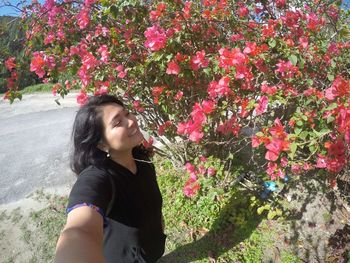 Young woman on flower plant