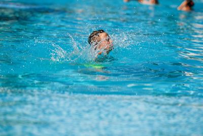 Man swimming in pool