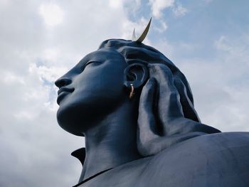 Low angle view of statue against sky