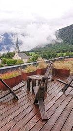 Scenic view of building and mountains against sky
