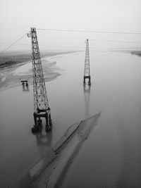 Electricity pylons in river