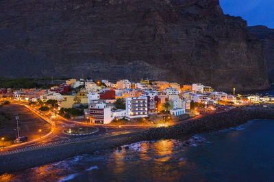 Illuminated buildings in city at night