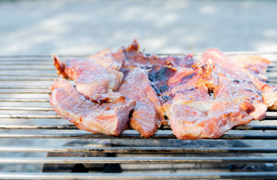 Close-up of meat on barbecue grill