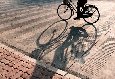 Low section of man riding bicycle