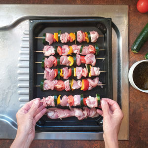 High angle view of meat on barbecue grill