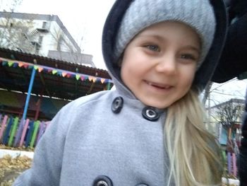 Portrait of smiling boy against sky