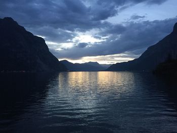 Scenic view of lake against sky during sunset