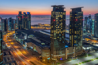 High angle view of illuminated city at night